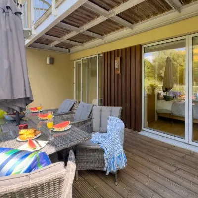 Lakeside decking outside the master bedroom at Velvet Lodge