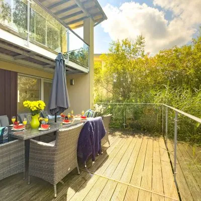 Lakeside decking outside the master bedroom at Velvet Lodge