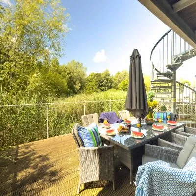 Lakeside decking outside the master bedroom at Velvet Lodge